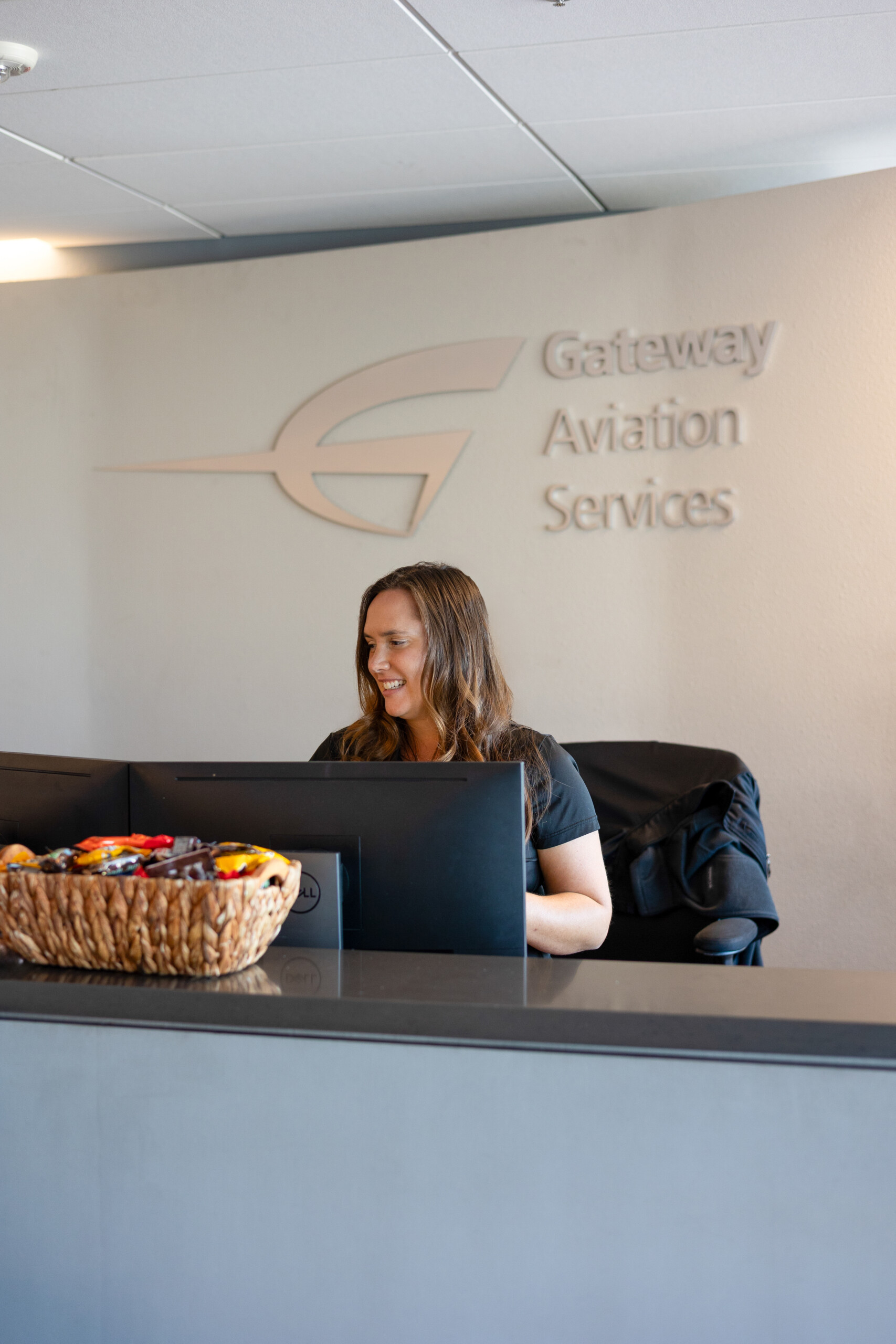 Receptionist at the Gateway Aviation Services desk