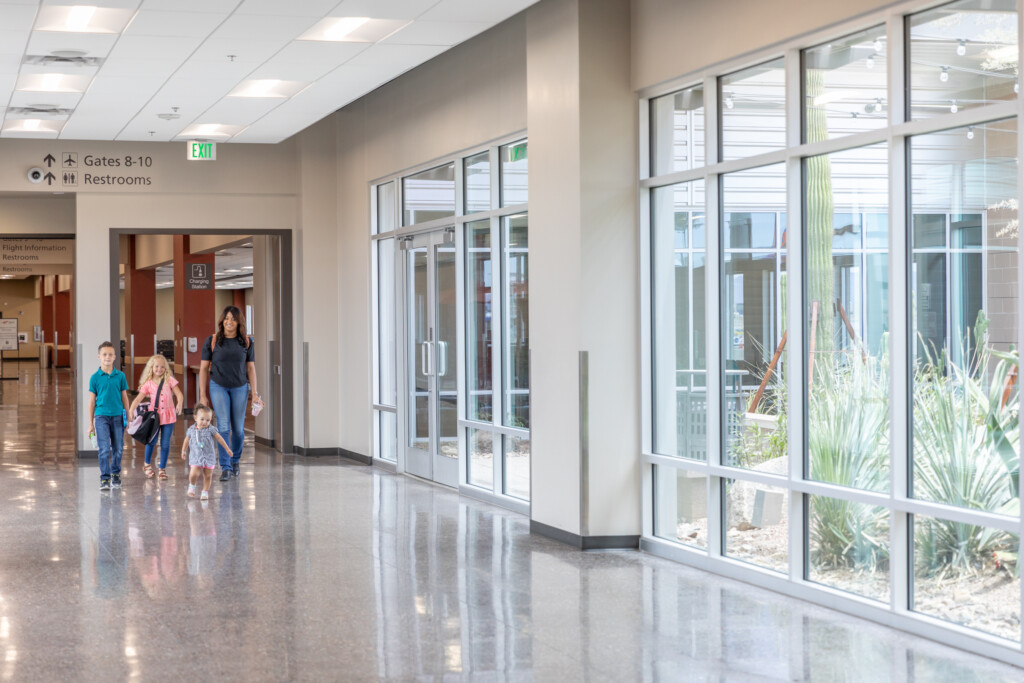 Family walking down the concourse toward the gates