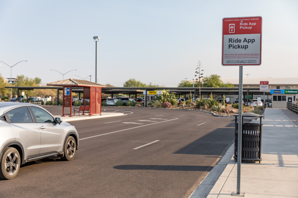 Ride app pickup area with a car pulling up