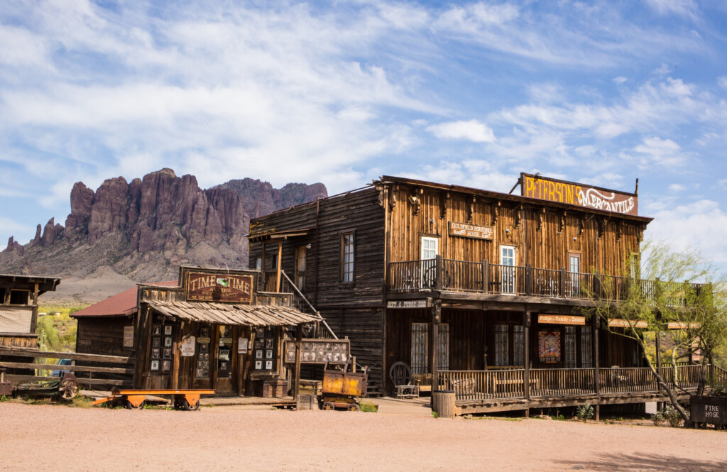 Old West storefront at Goldfield Ghost Town with the Superstition Mountains behind