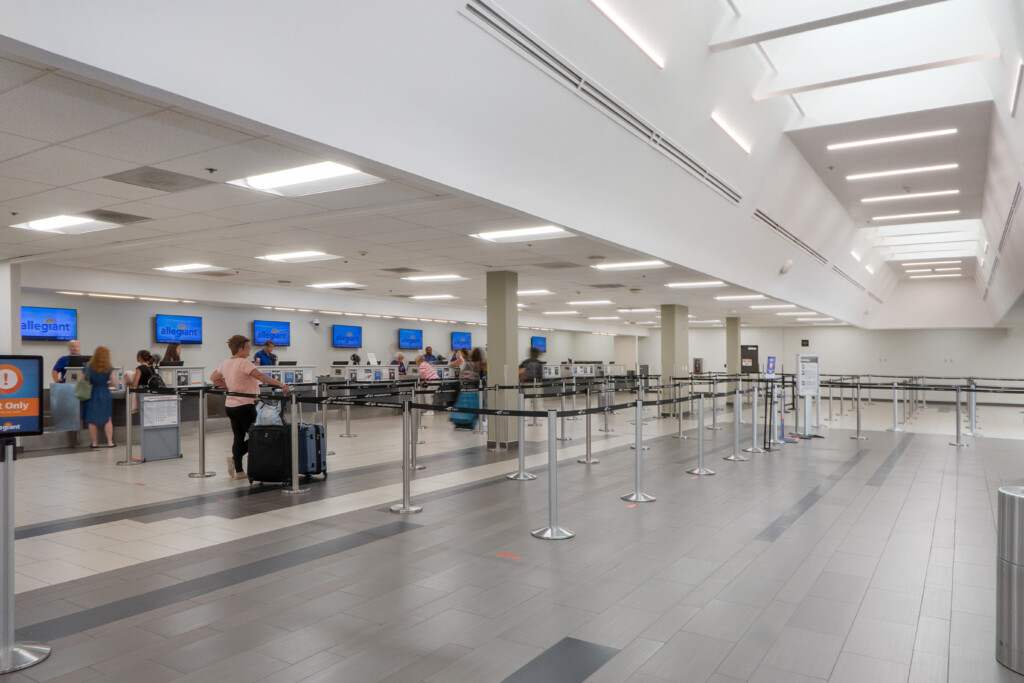 Ticketing hall with check-in counters and queue lanes