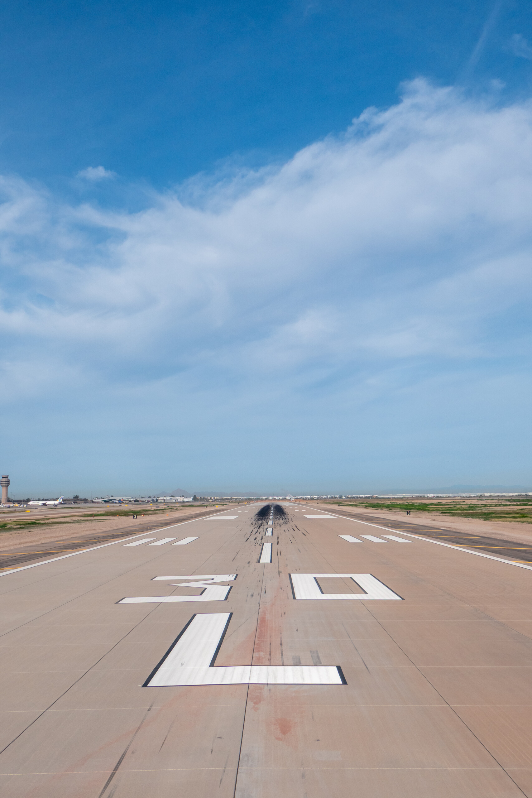 Runway 30 markings under a blue sky