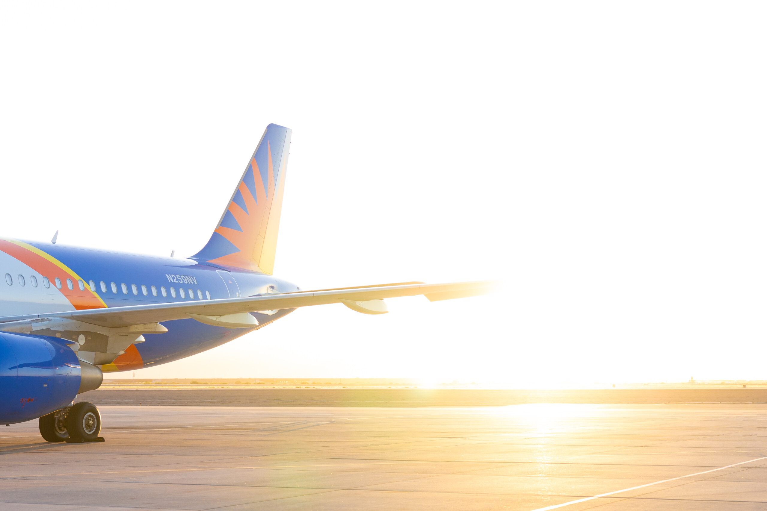 Allegiant aircraft on the ramp at sunset