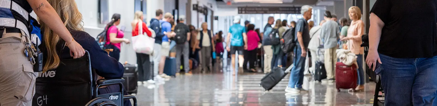 Busy terminal concourse with travelers