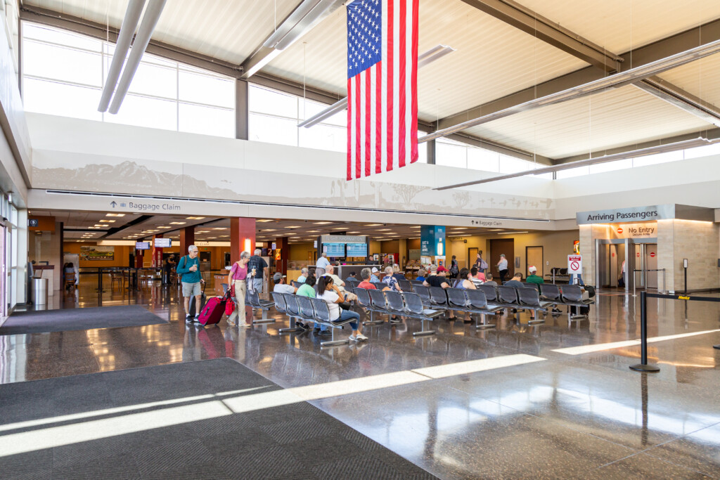 Terminal atrium with an American flag hanging above the concourse