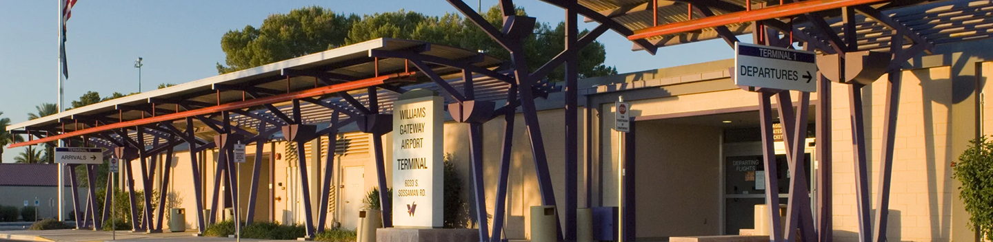 Covered walkway outside the terminal at sunset