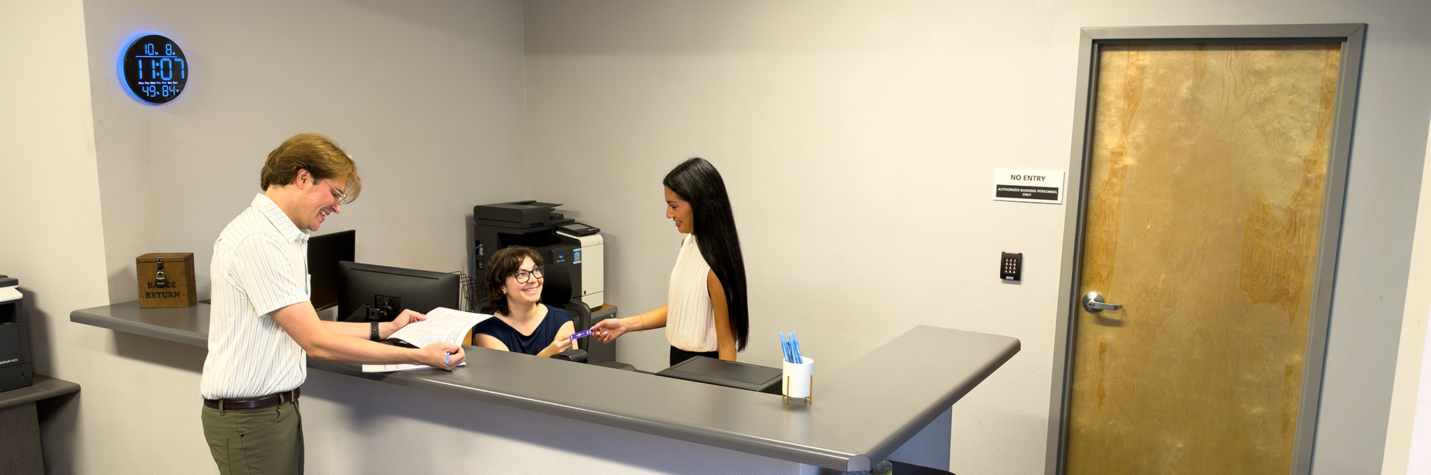 Mesa Gateway Airport Authority Badging Office staff assisting customers